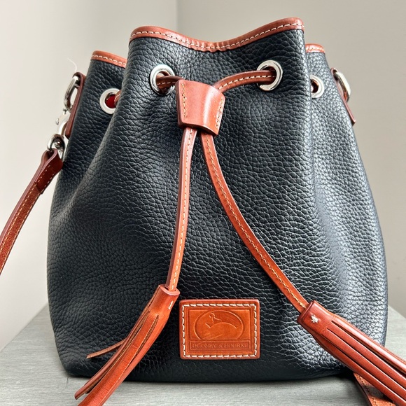 Dooney & Bourke Black Pebbled Leather Bucket Bag | British Tan Trim. EUC - Picture 1 of 5